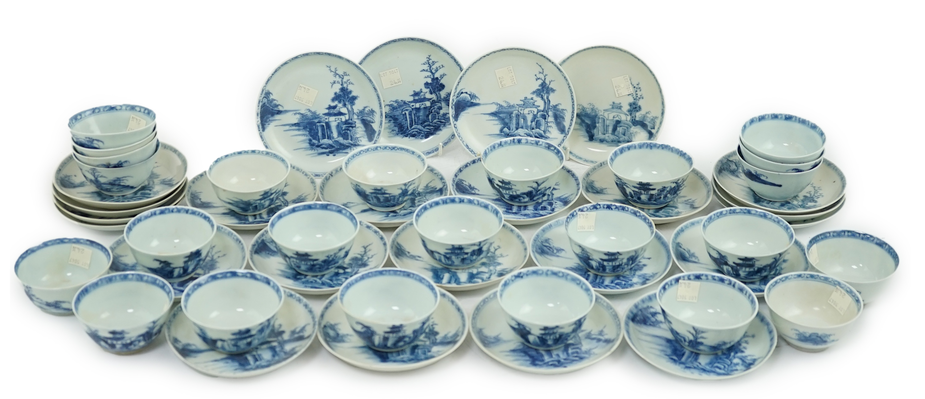 A set of twenty four Chinese Nanking Cargo blue and white ‘large pagoda’ tea bowls and saucers, Qianlong period
